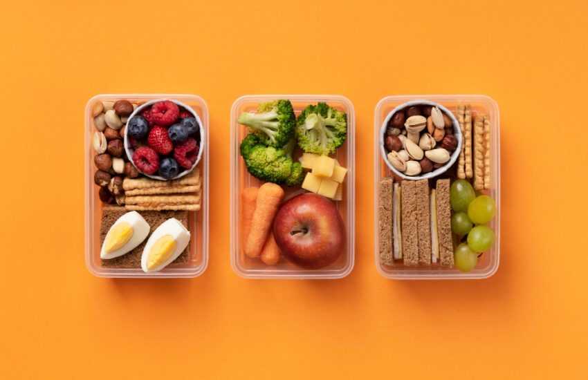 Tasty travel food lunch boxes arrangement above view
